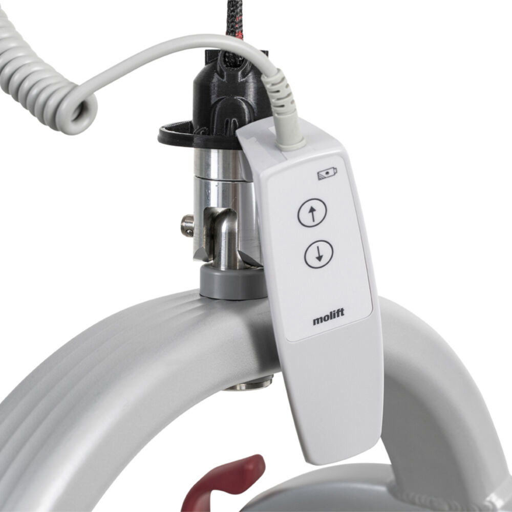 Molift Air 200 has a new intuitive hand control with hanger on sling bar and optional docking station for wall.